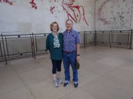 Ann and Greg in front of maps of landing