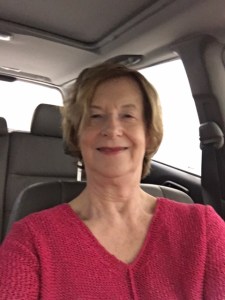 self-portrait in old car